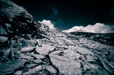 Scenic view of mountains against cloudy sky