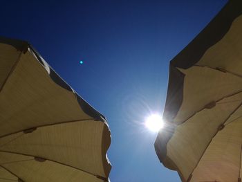 Low angle view of buildings against blue sky