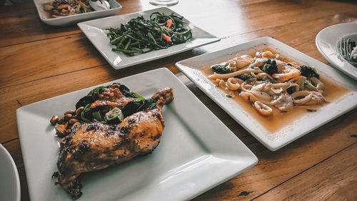 High angle view of fish in plate on table