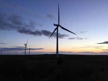 Wind turbines in field