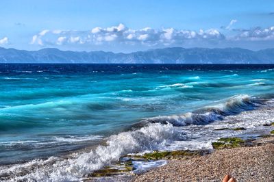 Scenic view of sea against cloudy sky