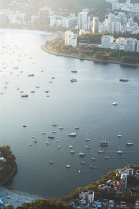 High angle view of sea and buildings in city