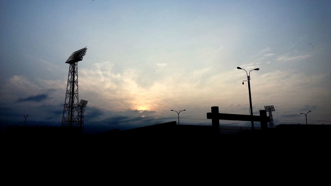 silhouette, sky, low angle view, sunset, crane - construction machinery, built structure, street light, industry, building exterior, architecture, copy space, crane, construction site, dusk, cloud - sky, fuel and power generation, technology, outdoors, nature, development