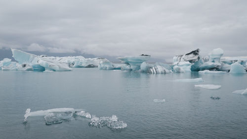 Scenic view of frozen lake against sky