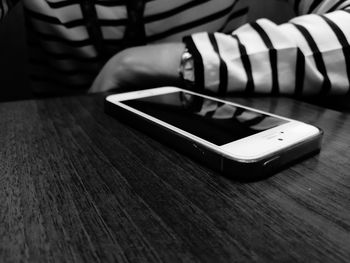 Low section of person using smart phone
