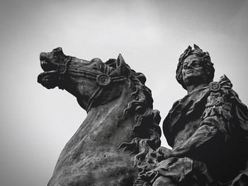 Low angle view of statue against sky