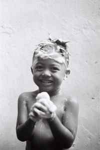 Portrait of a smiling boy in water