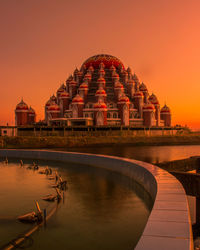 Low angle view of temple against cloudy sky