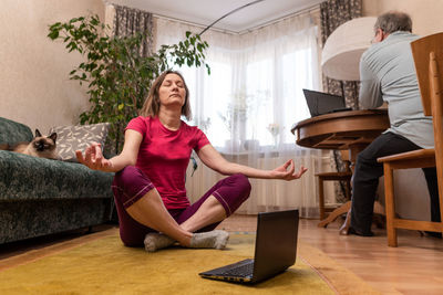 Women sitting on sofa at home