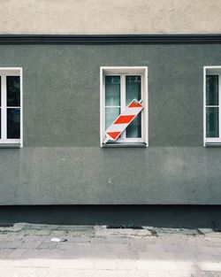 Sign board on closed window of building