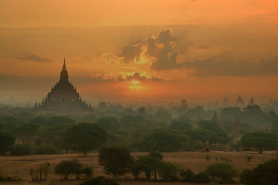 Temple against sky during sunset
