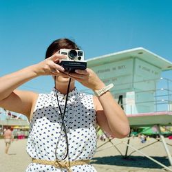 Woman photographing through smart phone