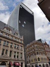 Low angle view of skyscraper against sky