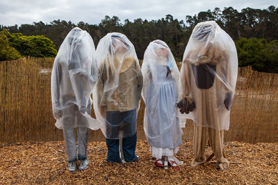 Mannequin covered with plastics on field