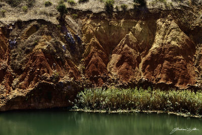 Scenic view of lake against mountain range