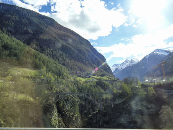 Scenic view of landscape and mountains against sky