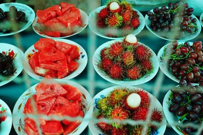 High angle view of fruits in plate on table