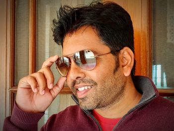 Portrait of smiling young man wearing eyeglasses