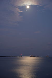 Scenic view of sea against sky at night