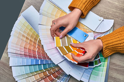 High angle view of woman painting on table