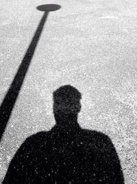 Shadow of people on road