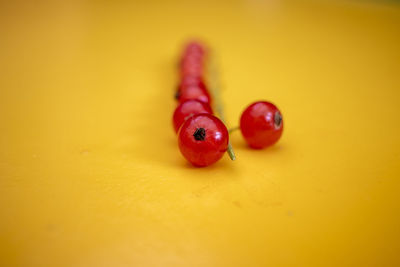 Close-up of cherries on table