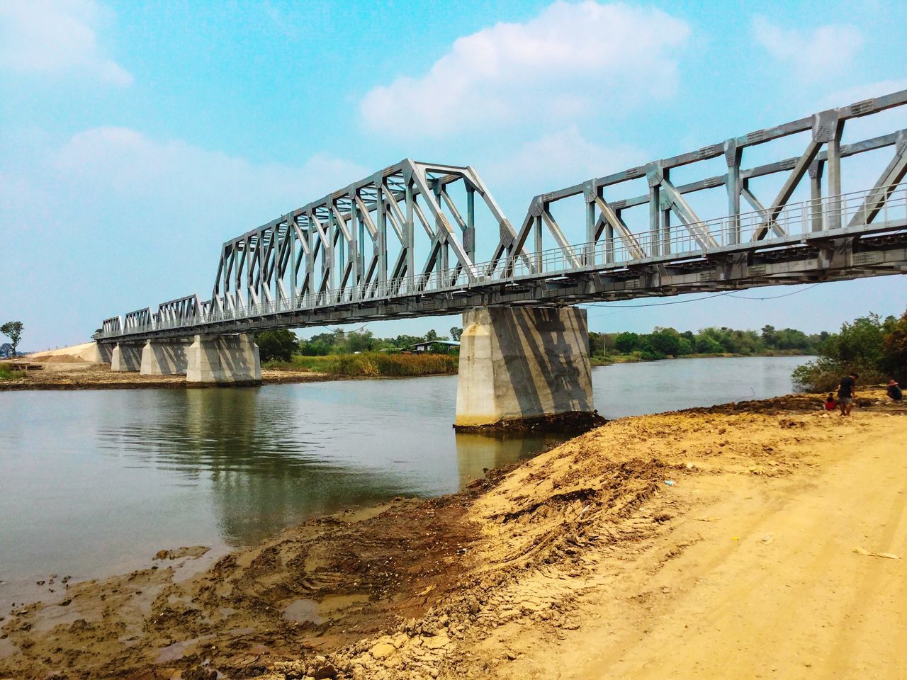 connection, bridge - man made structure, built structure, architecture, engineering, water, river, bridge, sky, transportation, suspension bridge, arch bridge, low angle view, long, cloud - sky, metal, no people, outdoors, cloud, travel destinations