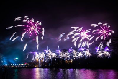 A beautiful, blurred, abstract fireworks display in riga in purple tones