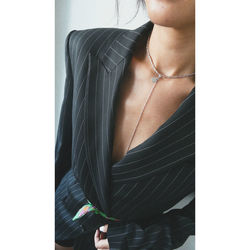 Midsection of woman standing against wall