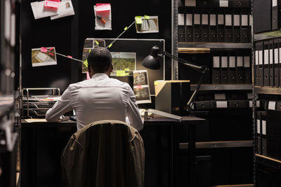 Rear view of woman standing in store