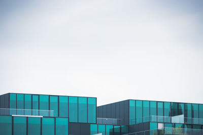 Low angle view of modern building against clear sky