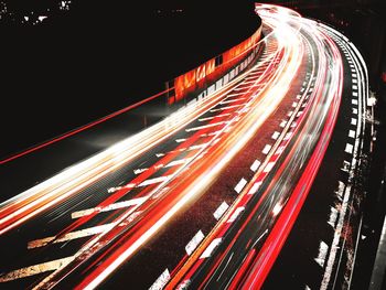 High angle view of light trails on road at night