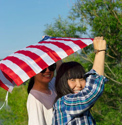 Women with usa flag, celebration of patriotic american national holiday 4th of july independence day