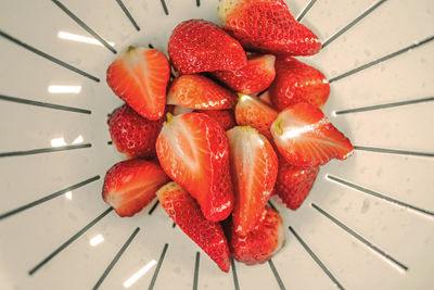 High angle view of strawberries in colander