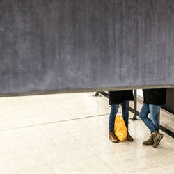 Low section of people standing on road