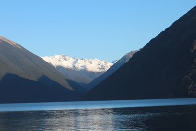 Scenic view of mountains against clear blue sky