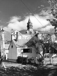 Low angle view of church against sky in city