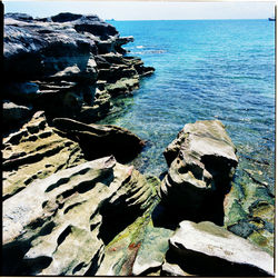 Scenic view of sea against blue sky