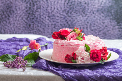 Close-up of pink roses on table