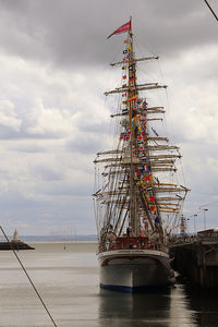 Boats in sea against sky