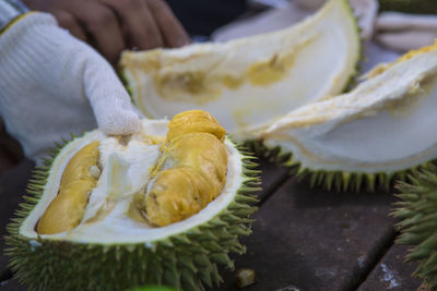 Close-up of hand holding fruit