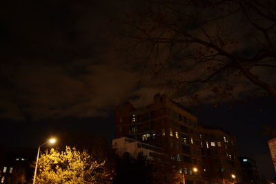 Illuminated city against sky at night