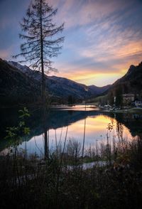 Scenic view of lake against sky during sunset