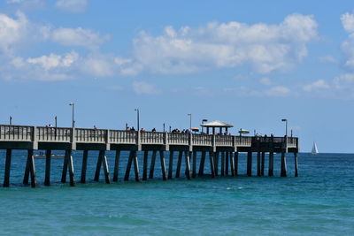 Pier over sea against sky