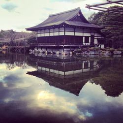 Reflection of built structure in calm lake