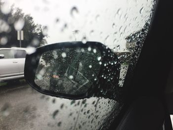 Close-up of rain drops on car window