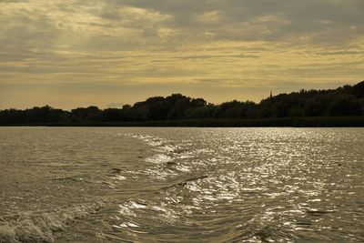 Scenic view of lake against sky during sunset