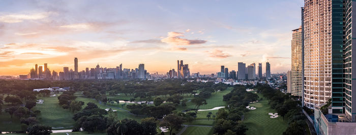 Panoramic view of buildings against sky during sunset