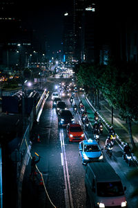 High angle view of traffic on city street at night