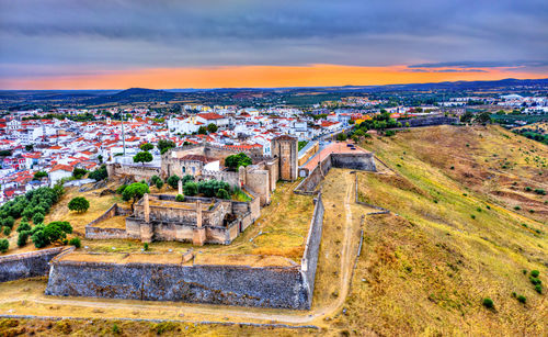 High angle view of townscape against sky during sunset